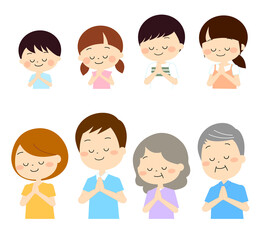 手を合わせているさまざまな年代の人物セット　秋冬