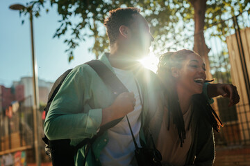 Joyful couple exploring city abroad.