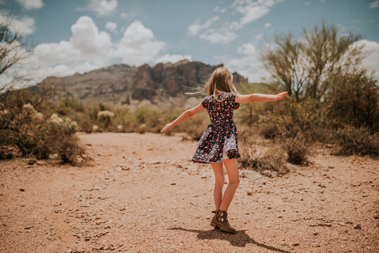 Girl twirling in the Arizona Desert sun