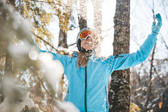 Woman In Ski Goggles And Helmet In Backlit Snow Scene In New Hampshire