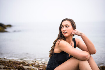 Young Woman at the Beach on a Rainy Day