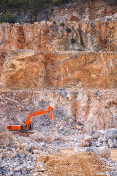 excavator working at gravel mine in Thailand