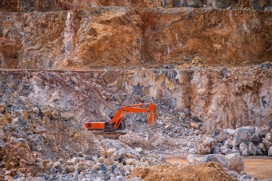 excavator working at gravel mine in Thailand