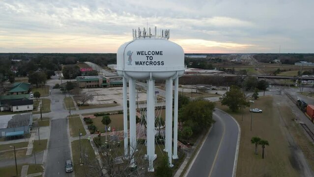 Water tower in Waycross Georgia at Sunset Aerial View Boom Down