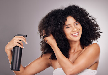 Face of black woman spray product on hair for natural wellness, growth and shine on gray...