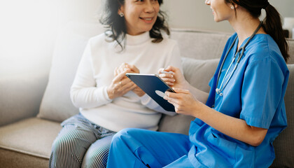 Obraz premium Asian female hands touching old female hand Helping hands take care of the elderly concept in hospital