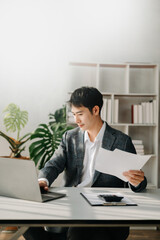 Naklejka premium Mature business man executive manager looking at laptop watching online webinar training or having virtual meeting video conference doing market research working in office.