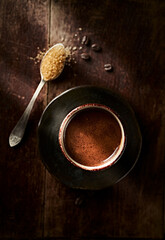 Cup of coffee on  rustic wooden background. Top view