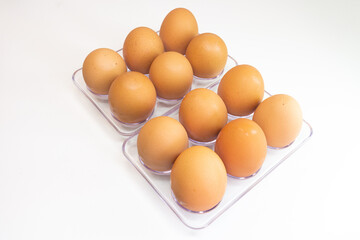 eggs in a plastic tray on a white background, top view