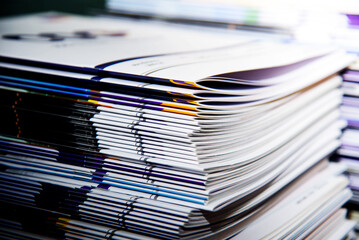 Close up of a stack of magazines with shallow depth of field.