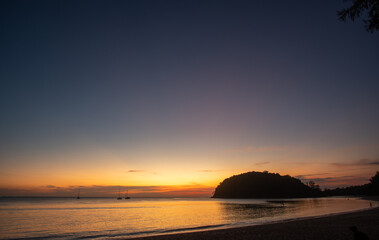 aerial view beautiful sunset above Kala island at Layan beach Phuket..colorful sky of sunset at horizon.Phuket beach sea Amazing beach, .Beautiful beach Phuket Thailand, Nature and travel concept.