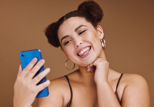 Selfie, happiness and woman smile with a phone feeling excited, happy and beauty for profile picture. Social media, isolated and studio background with mockup of gen z, young and face of young person
