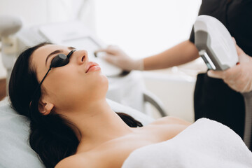 Obraz na płótnie Canvas Laser epilation and cosmetology. Hair removal cosmetology procedure. Laser epilation and cosmetology.