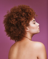 Woman, shoulder or afro hairstyle on isolated purple background in empowerment, curly maintenance or skincare salon. Beauty model, natural or hair growth texture on cosmetics studio or relax backdrop