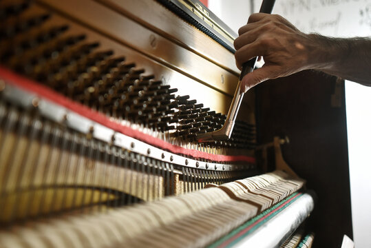 Piano tech, piano tuner upright piano tuning
