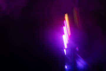 Blurred Light painting one exposure in camera. light glares with a spectral gradient on a dark...