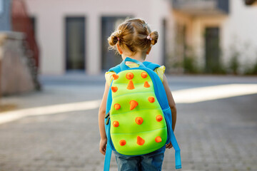 Cute little adorable toddler girl on her first day going to playschool. Healthy beautiful baby...