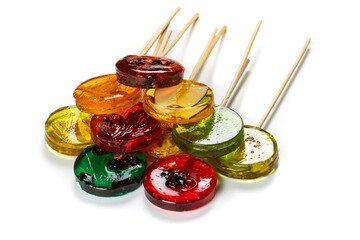 Sweet colorful lollipops with dried fruits on white background