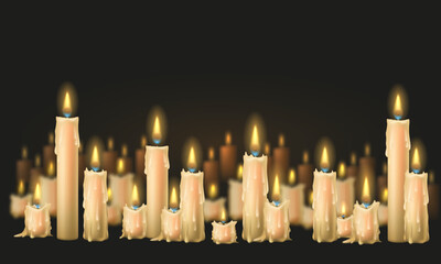 A glowing candles with melted wax. Composition of burning candles on dark background.