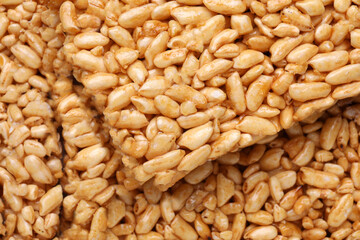 Puffed rice bars (kozinaki) as background, top view