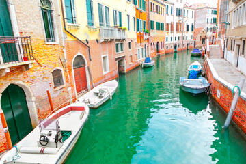 Venice water canal with boats . Italian town on the water 