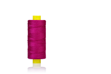 skein of thread pink colors macro on a white background