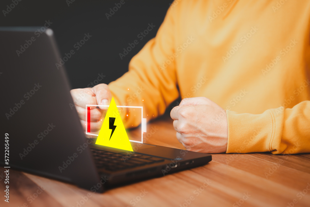 Aufkleber young man is angry and frustrated when he learns that his the laptop computer's battery is dead and 