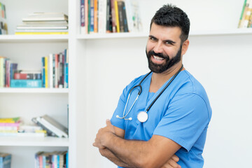 Laughing mexican mature male doctor or nurse