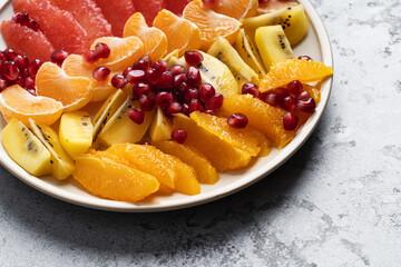 Tropical fruit salad dessert, healthy vegan food, close up