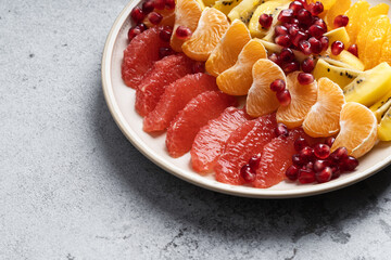 Tropical fruit salad dessert, healthy vegan food, close up