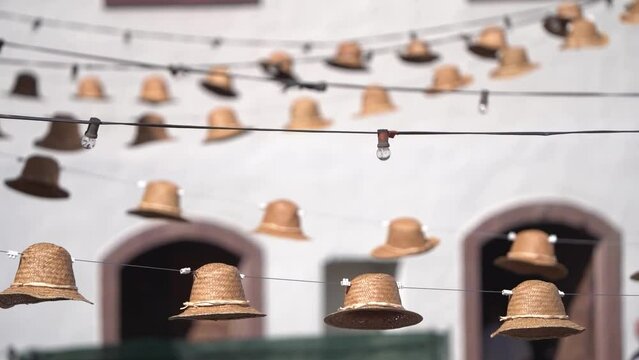 Hats hunging at the streets of Tejeda town in Gran Canaria, Spain for decoration as traditional decorative tradition. 