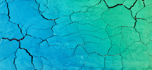 Colorful blue green cracks suface. Astract background banner format