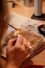 Silversmith's creating jewellery in their studio