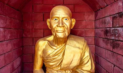 Bronze Buddha statue in a temple in Mae Sot Thailand