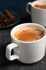 Fotobehang Delicious eggnog with anise and cinnamon on grey table © New Africa