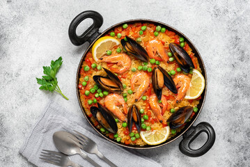 Paella with seafood. Traditional Spanish paella with shrimps and mussels. Top view, flat lay.