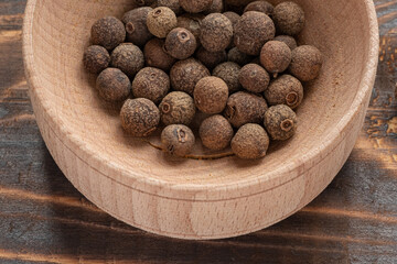 allspice in a wooden bowl