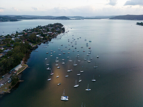 Aerial image looking south from Gosford at boats moored in Brisbane Water at dusk