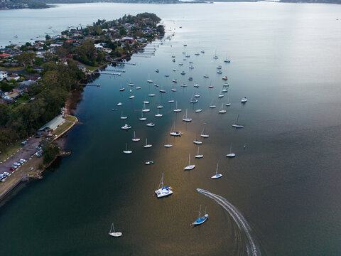 Aerial image looking south from Gosford at boats moored in Brisbane Water at dusk