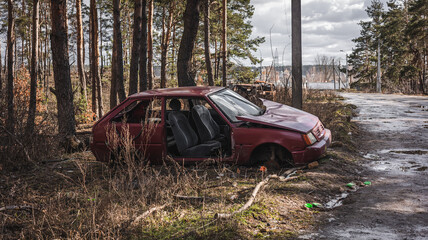 War in Ukraine, abandoned car near the road, damaged car Irpin, Kyiv region.