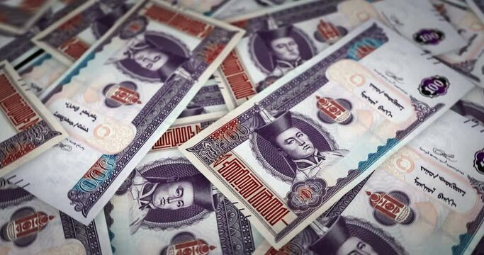 Mongolia Togrog growing pile of money. MNT banknotes loop rotaring. Seamless and looped background concept of finance, economy crisis, inflation and business.