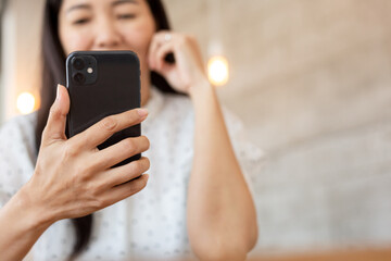 woman using cell phone hand holding mobile texting message contact us.chatting,search internet information.technology device communication connecting