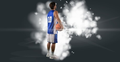 Composition of male basketball player holding basketball with copy space