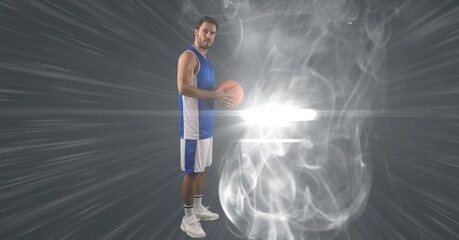 Fototapeta na wymiar Composition of male basketball player holding basketball with copy space