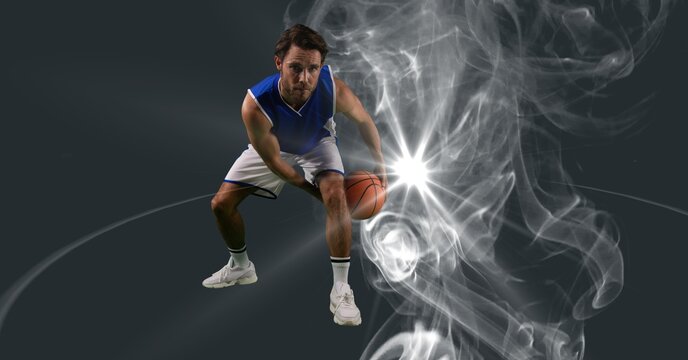 Composition of male basketball player holding basketball with copy space