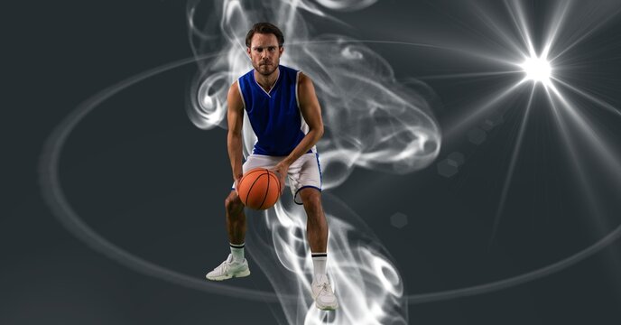 Composition of male basketball player holding basketball with copy space