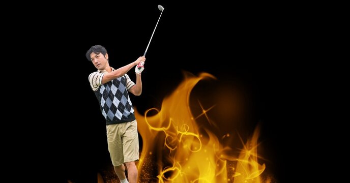 Composition of male golf player over flames on black background