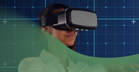 Businesswoman wearing vr headset over grid network against green technology background