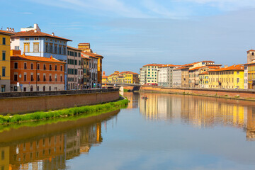 Fototapeta premium View on Arno river and colorful building, Pisa, Italy