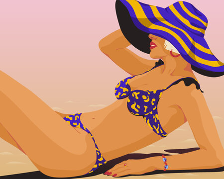 Woman laying on the beach in a matching bikini and floppy hat